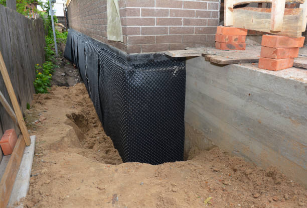 SJ Waterproofing Pros technician performing targeted Emergency Waterproofing assessment in Larsen, WI